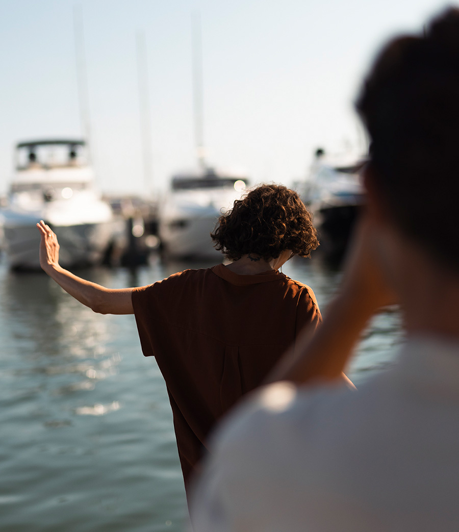 couple taking pictures at marina in vilamoura